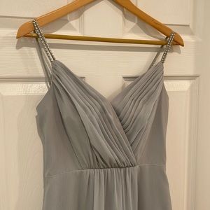 Elegant light platinum gray bridesmaid or prom gown with rhinestone straps